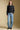 A full body front view of a woman wearing the Saltwater Luxe Verity Sweater on a neutral background