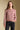 Front view of a woman wearing the Saltwater Luxe Verity Sweater on a neutral background with hand in pocket
