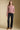 A full body front view of a woman wearing the Saltwater Luxe  Verity Sweater on a neutral background