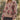 Front view of a woman wearing the floral Saltwater Luxe Vincent Sweater in a garden over the Nolla Skirt