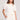Front view of a woman wearing the Saltwater Luxe Short Sleeve Ecru Pullover on a neutral background