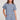 Front view of a woman wearing the Saltwater Luxe Short Sleeve Worn Blue Pullover on a neutral background
