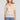 Front view of a woman wearing the Saltwater Luxe Siera Top in Sunglow on a neutral background