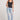 Full body front view of a woman wearing the Saltwater Luxe Slim Black Tank on a neutral background
