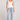 Full body front view of a woman wearing the Saltwater Luxe Slim Ecru Tank on a neutral background