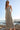 Front view of a woman wearing the Saltwater Luxe Stein Midi Dress on the beach