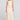 Full body front view of a woman wearing the Saltwater Luxe Suzi Midi Skirt in Natural on a neutral background
