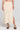 Front view of a woman wearing the Saltwater Luxe Suzi Midi Skirt in Natural on a neutral background