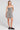 Front view of a woman wearing the Saltwater Luxe Sydney Mini Dress on a neutral background