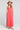 Front view of a woman wearing the Saltwater Luxe Tarynnia Cranberry Maxi Dress on a neutral background
