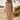 Front view of a woman wearing the Saltwater Luxe Taytum Maxi Dress on a beach