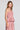 Side angle view of a woman wearing the Saltwater Luxe Tremont Tank in Coffee on a neutral background