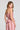 Back view of a woman wearing the Saltwater Luxe Tremont Tank in Coffee on a neutral background
