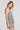 Side angle view of a woman wearing the Saltwater Luxe Viena Tank on a neutral background