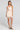 Front view of a woman wearing the Saltwater Luxe Waverlee Mini Dress in Natural on a neutral background