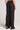 Back view of a woman wearing the Saltwater Luxe  Woven Black Pull On Pant on a neutral background