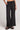 Front view of a woman wearing the Saltwater Luxe  Woven Black Pull On Pant on a neutral background