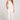 Full body front view of a woman wearing the Saltwater Luxe Woven Ecru Pull On Pant on a neutral background
