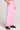 Side angle view of a woman wearing the Saltwater Luxe Petunia Pull-On Pant on a neutral background