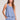 Front view of a woman wearing the Saltwater Luxe Woven Worn Blue A-Line Tank on a neutral background
