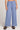 Front view of a woman wearing the Saltwater Luxe Woven Worn Blue Pull On Pant on a neutral background