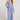 Full body front view of a woman wearing the Saltwater Luxe Woven Worn Blue Pull On Pant on a neutral background