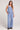 Full body front view of a woman wearing the Saltwater Luxe Woven Worn Blue Pull On Pant on a neutral background