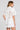Back front view of a woman wearing the Saltwater Luxe Zerra Top on a neutral background
