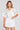 Front view of a woman wearing the Saltwater Luxe Zerra Top on a neutral background